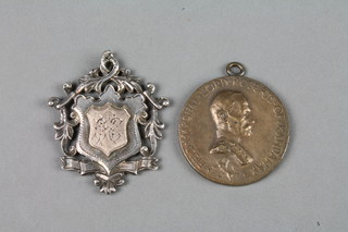 A silver sports fob and a variety of miniature rifle clubs 