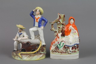 A 19th Century Staffordshire spill vase - Little Red Riding Hood 10" and a ditto of 2 sailors loading a cannon 4, f, 8" 