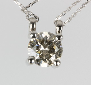 An 18ct white gold single stone diamond pendant, approx 0.87 ct, on a ditto chain
