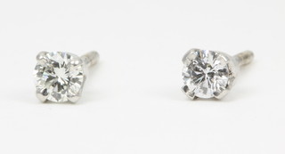 A pair of white gold diamond single stone screw back ear studs, approx 0.3ct
