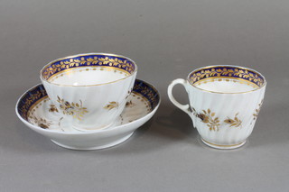 A Worcester style blue and gilt banded tea bowl and saucer  together with matching tea cup