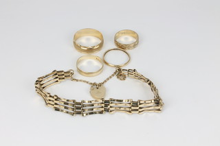 A 9ct gold gate bracelet and padlock and 4 9ct gold wedding bands, approx 13.3 grams