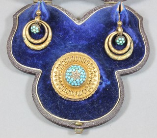 A mid Victorian gilt metal suite of jewellery comprising a turquoise set etruscan style brooch and a pair of double hoop drop turquoise earrings