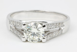 An 18ct white gold diamond ring the centre stone approx. 1.01ct, the open shank with brilliant cut diamonds approx. 0.35ct
