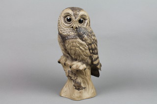 A 1970's Poole brown glazed figure of an owl on a rocky stump by B Linley-Adams 8 1/2"