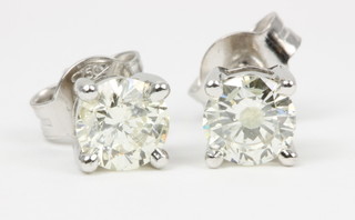 A pair of 18ct white gold single stone diamond ear studs, approx 1.03ct