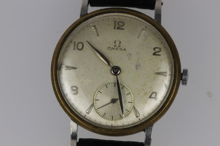 A gentleman's steel cased Omega wristwatch with seconds at 6 o'clock, a silver and tigers eye signet ring 