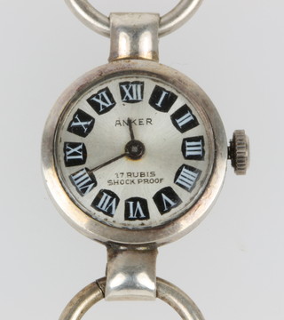 A lady's stylish Anker wristwatch on a chain link bracelet and a gem set ring
