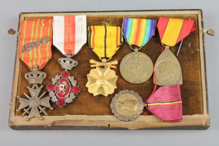 A Belgian medal group comprising Croix de Guerre with oak leaf cluster, a Red Cross Civic Award, a 1914-18 Victory medal, King Albert medal and 1914 commemorative war medal