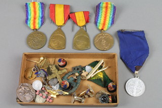 A Belgian medal group comprising 2 1914-18 Victory medals and 2 1914-18 commemorative war medals, together with minor medals and badges