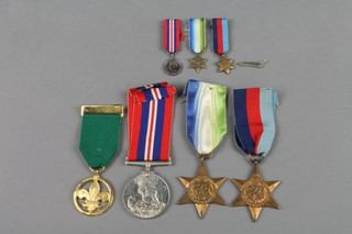 A World II medal group comprising Atlantic, 1939-45 Star, British War medal, 3 ditto miniatures and a Duke of Edinburgh Awards medal