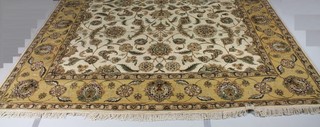 A white ground Indian carpet with floral decoration 140" x 107"