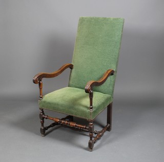 A 19th Century mahogany high back elbow chair with scroll arms and turned supports