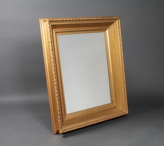 A rectangular bevelled plate wall mirror contained in a decorative gilt frame 43" x 34"