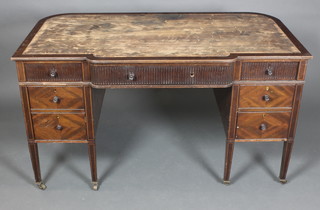 A Maples Edwardian D shaped mahogany writing table fitted 1 long drawer with reeded decoration, flanked by 6 short drawers, raised on square tapering supports  30"h x 54"w x 30"d 