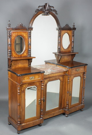 A Victorian inlaid walnut chiffonier sideboard, the raised back fitted an arched bevelled plate mirror flanked by 2 oval mirrors, the base with niche and fitted marble panel above a cupboard enclosed by a mirrored door flanked by a pair of cupboards enclosed by glazed panelled doors 90"h x 58 1/2"w x 15 1/2"d