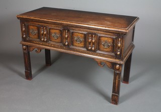 A Jacobean style carved oak 2 drawer serving table with moulded decoration, raised on straight legs 32" x 48" x 20"