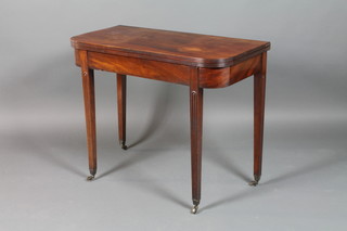 A 19th Century D shaped mahogany folding card table, raised on square fluted supports 29"h x 36"w x 17 1/2"d