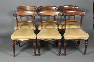A set of 6 William IV mahogany bar back dining chairs with plain mid rails and shaped seats, raised on turned and reeded legs with rear sabre supports