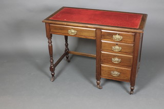 An Edwardian Art Nouveau mahogany desk with inset red leather skiver above 1 long drawer flanked by 4 short drawers, raised on fluted and turned legs, 30"h x 39"w x 20"d 