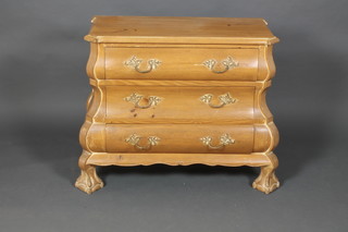 A French bombe shaped pine chest of 3 long graduated drawers, raised on ball and claw supports 33"h x 38"w x 16 1/2"d