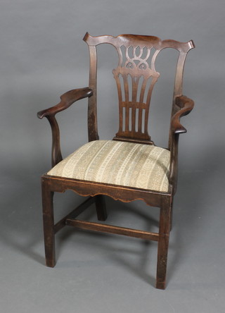 A Georgian mahogany open arm chair with upholstered drop in seat and box framed stretcher