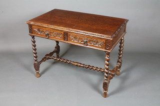 An early 18th Century style oak side table fitted 2 foliate carved short drawers raised on barley twist column supports and baluster  feet 29"h x 39"w x 24"d