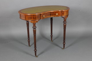 An Edwardian inlaid mahogany kidney shaped writing table fitted  a drawer, raised on turned and fluted supports 29"h x 35"w x  14"d
