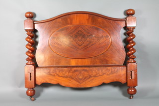 A Victorian mahogany arch shaped headboard with spiral turned columns to the sides 46 1/2"h x 58"w x 5"d (some holes to base from former fittings)