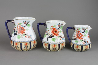 A set of 3 graduated Losol Ware jugs decorated in the Shang Hai pattern