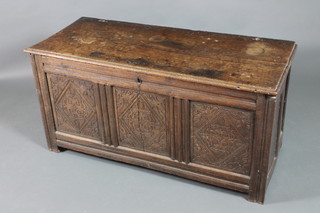An 18th Century oak coffer of carved panelled construction with hinged lid (cracked) 25"h x 51"w x 31"d 