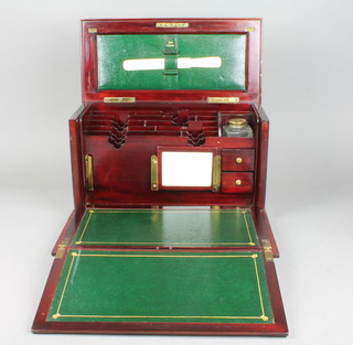 An Edwardian mahogany writing slope with fitted interior and square glass inkwell 8" x 14 1/2"w x 7"d 