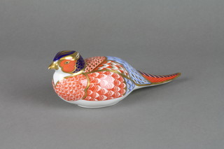 A Royal Crown Derby figure of a seated bird 