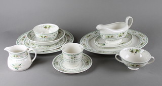 A Royal Doulton Provincial Design tea and dinner service comprising 7 tea cups, 8 saucers, 6 side plates, 6 soup bowls and stands, a sugar bowl, cream jug, sauce boat and stand, oval meat plate, 6 bowls and 12 dinner plates together with a Royal Kent part tea set comprising 6 cups, 6 saucers, 6 side plates, 6 medium plates, 6 dinner plates, an oval bowl and meat plate