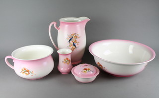 A 1920's Crownford Blossom Time wash stand set comprising wash jug, basin, soap dish, toothbrush holder and chamber pot decorated with song birds amongst flowers