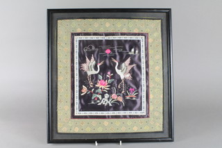 A framed Chinese square silk work embroidery of Ho Ho birds amongst flowers 15"