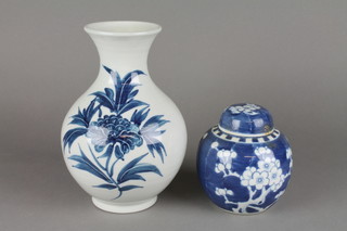 A Chinese blue and white prunus ginger jar and cover 5", a blue and white vase