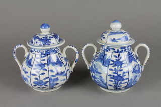 A pair of good 19th Century Chinese blue and white posset pots and covers, the baluster bodies with simple scroll handle and splayed lids with knop finials, decorated with alternate panels of flowers and extensive mountainous landscapes 7" 