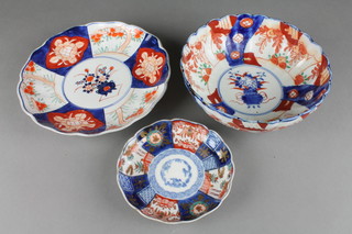 A 19th Century Imari shallow scalloped dish decorated with panels of flowers and gardens, having a 4 character mark to the base 5.5" and an Imari deep bowl and dish 
