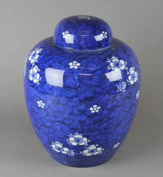 A Chinese blue and white prunus pattern ginger jar and cover 10" (lid cracked and chipped)