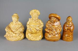 A set of 4 Saddler's brown glazed storage jars in the form of Chinamen 