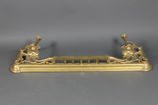 An Art Nouveau brass fender 54" 
