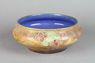 A Royal Doulton shallow bowl, the tan glaze with stylised flowers, impressed Lord Desborough Lodge no.3200 9" (f)