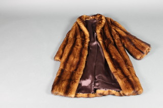 A ladies brown mink coat 