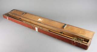 A set of mahogany and brass banded trammel points 39", cased 