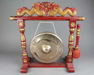 A Chinese circular bronze gong 9", raised on a turned and painted stand
