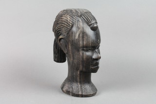 A carved African hardwood portrait bust of a lady 8"