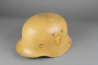 A German sand painted steel helmet 