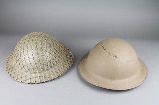 A WWII British steel helmet, the liner marked 1940 and 1 other marked '54