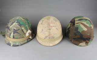 2 American steel helmets complete with liners together with a tank drivers helmet?